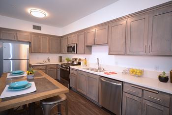 Yolo apartments kitchen with stainless steel appliances